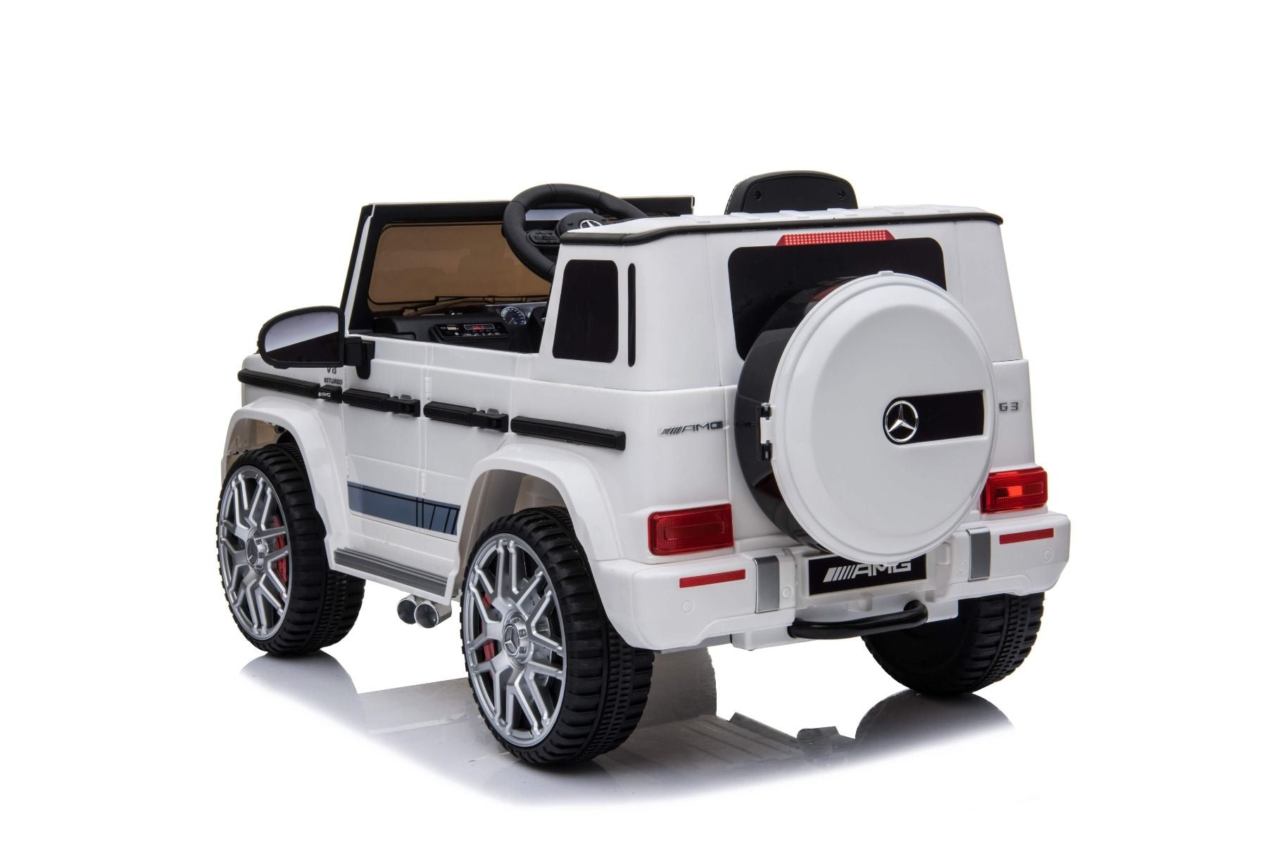 Voiture électrique enfants 12V Mercedes AMG G63 neuve, blanc, avec licence d'origine, porte à batterie, ouverture par des portes, monoplace, 2x moteur, batterie 12 V, télécommande de 2,4 Ghz, suspension arrière, démarrage en douceur