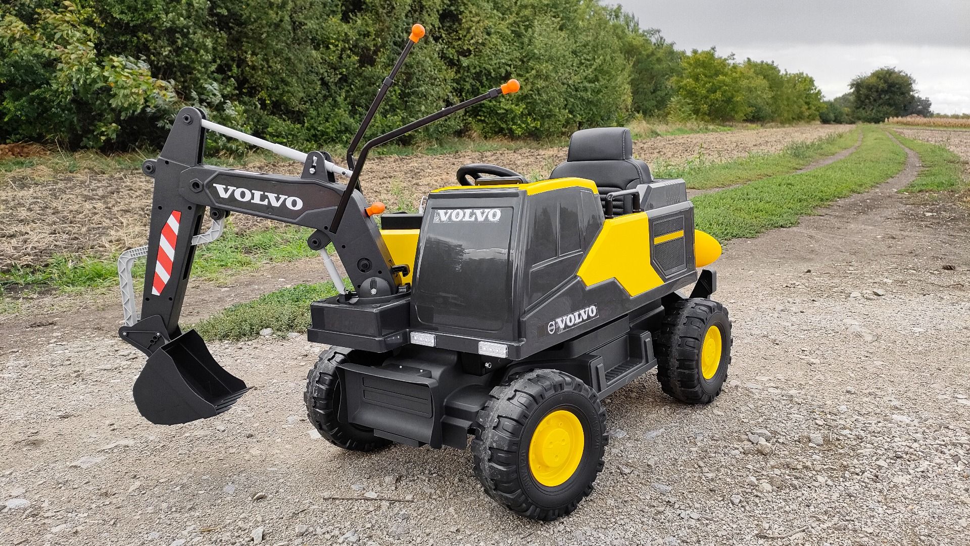Voiture électrique enfants 12V Volvo Excavator, jaune, moteur 2 x 35W, roues EVA, batterie 12V/14Ah, sous licence