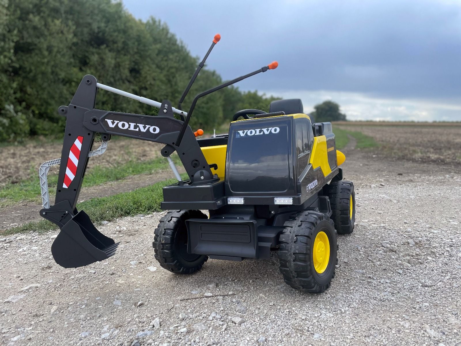 Voiture électrique enfants 12V Volvo Excavator, jaune, moteur 2 x 35W, roues EVA, batterie 12V/14Ah, sous licence