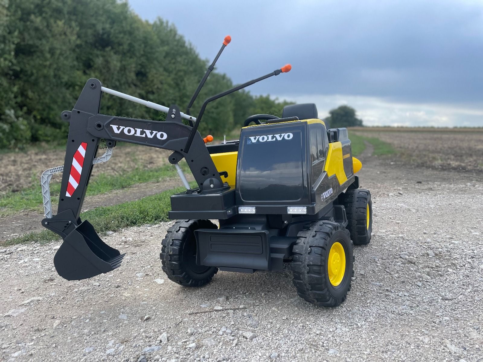 Voiture électrique enfants 12V Volvo Excavator, jaune, moteur 2 x 35W, roues EVA, batterie 12V/14Ah, sous licence